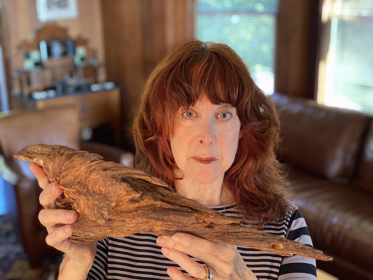 Mandy Aftel holding rare Sasora oud – A precious and highly valued material used in perfumery